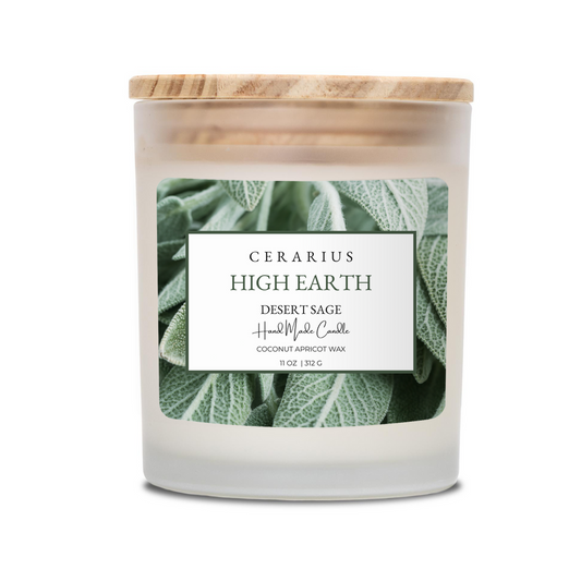 Candle with a wooden lid and green leaf design on a white background